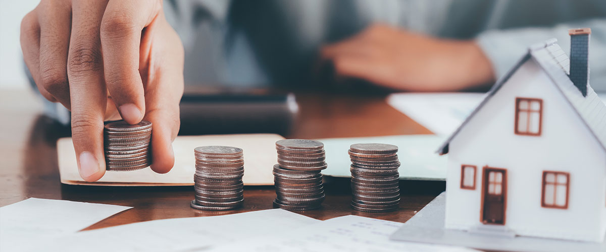 person calculating the average cost of a water filtration system for his home
